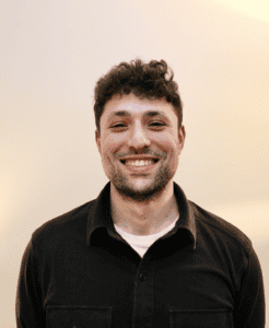 Jason Kantor smiling at Tropics International event.